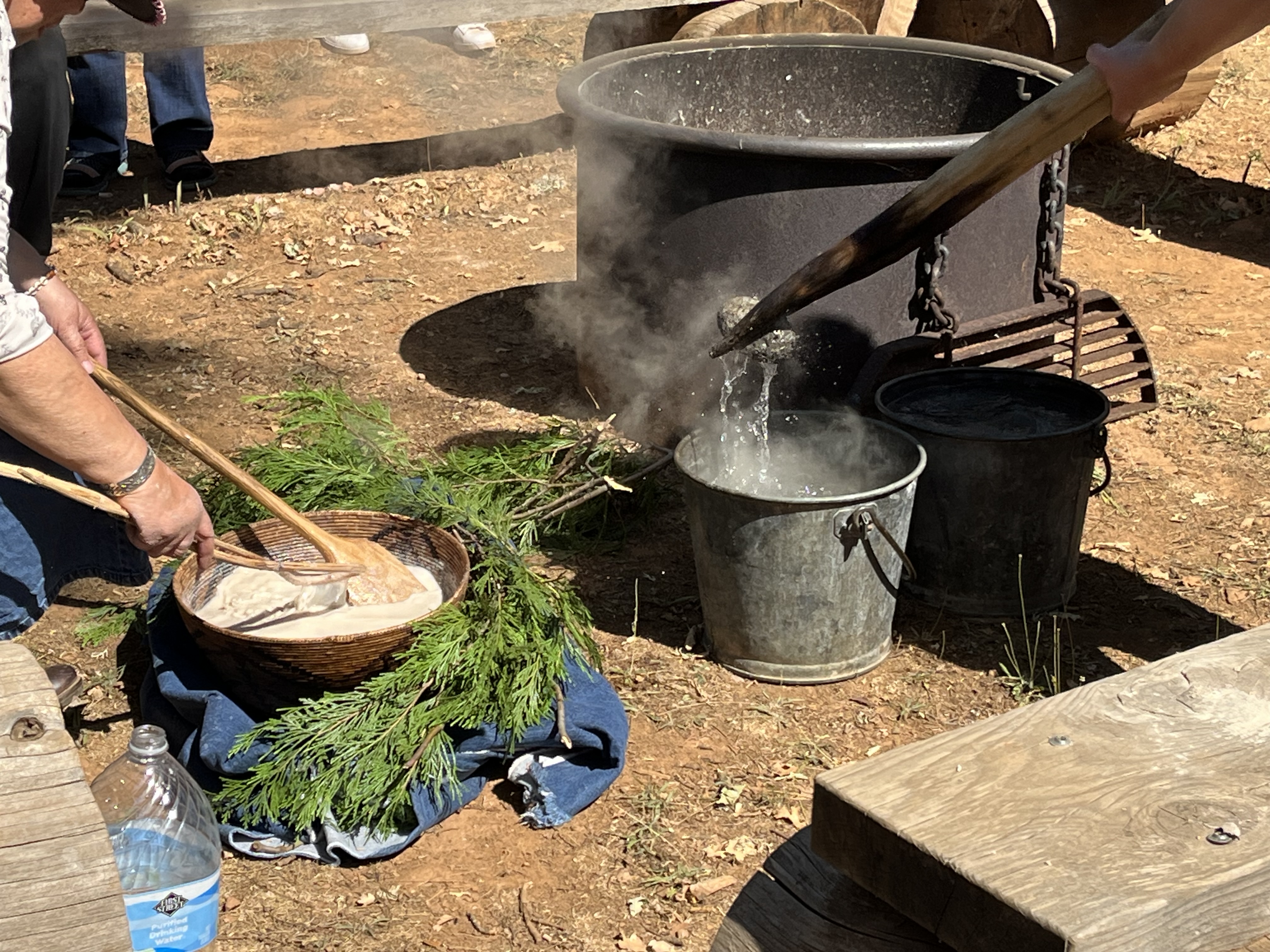 Cooking acorn mush in basket with hot rocks